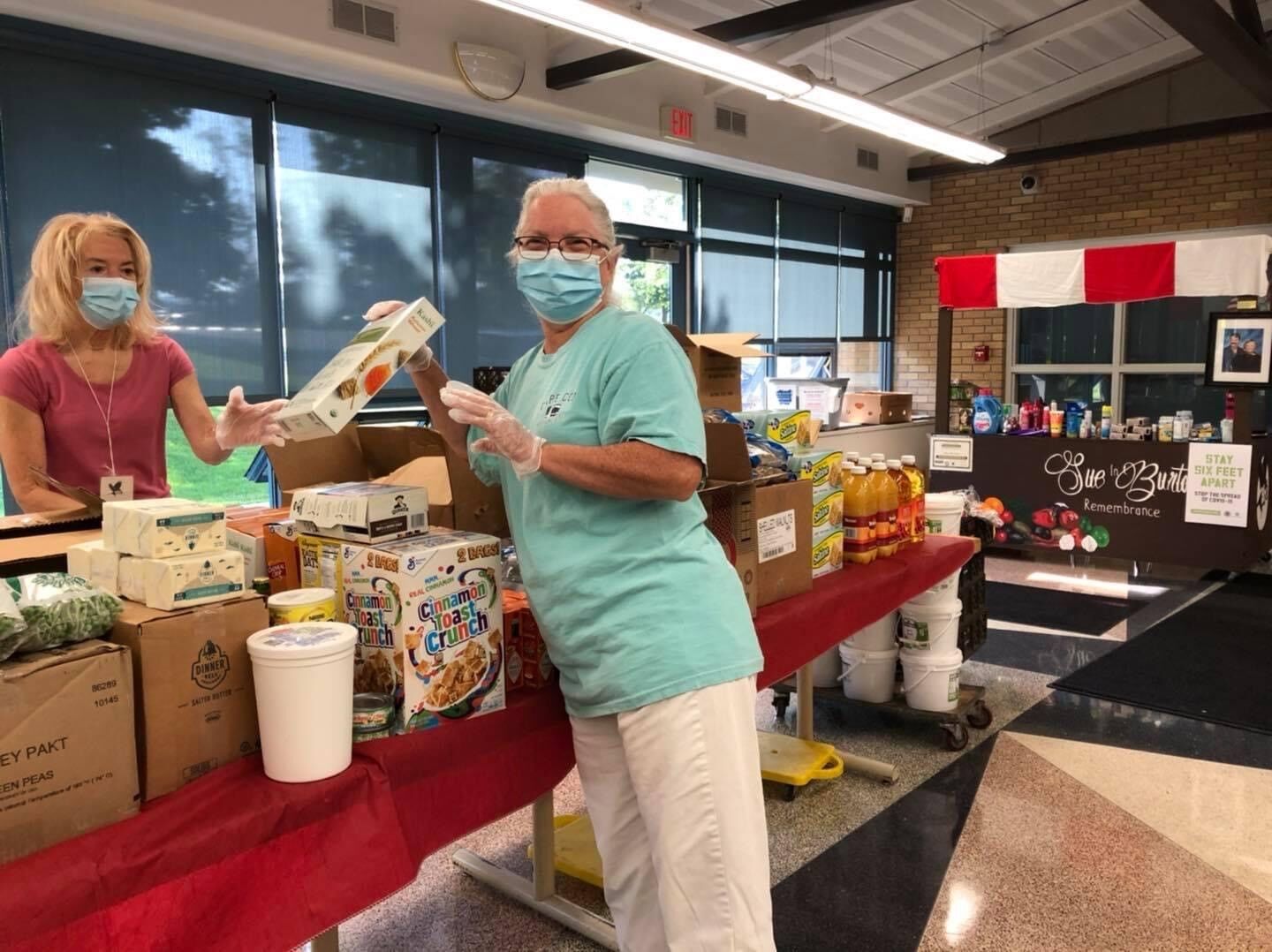 Sent by Ravens volunteers set up food pantry tables!